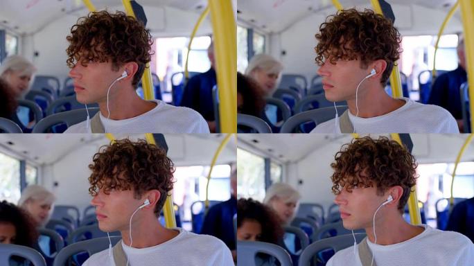 男性通勤者乘坐4k公交车时在耳机上听音乐