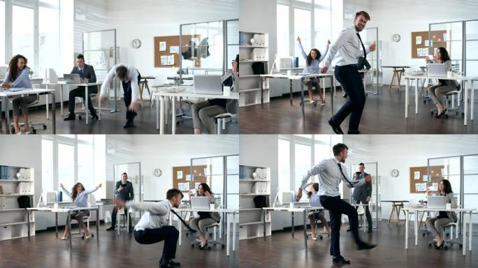 快乐的商人在办公室跳舞和表演杂技技巧