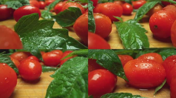tomatos和basil叶子组成的超级微距在木制桌子上，相机非常靠近它们。