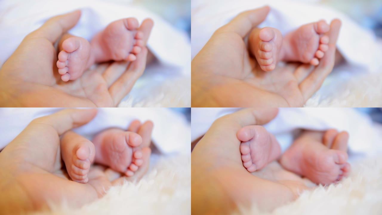 母亲手中的新生婴儿脚