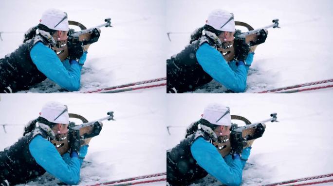 一名女运动员射击的雪地射击区