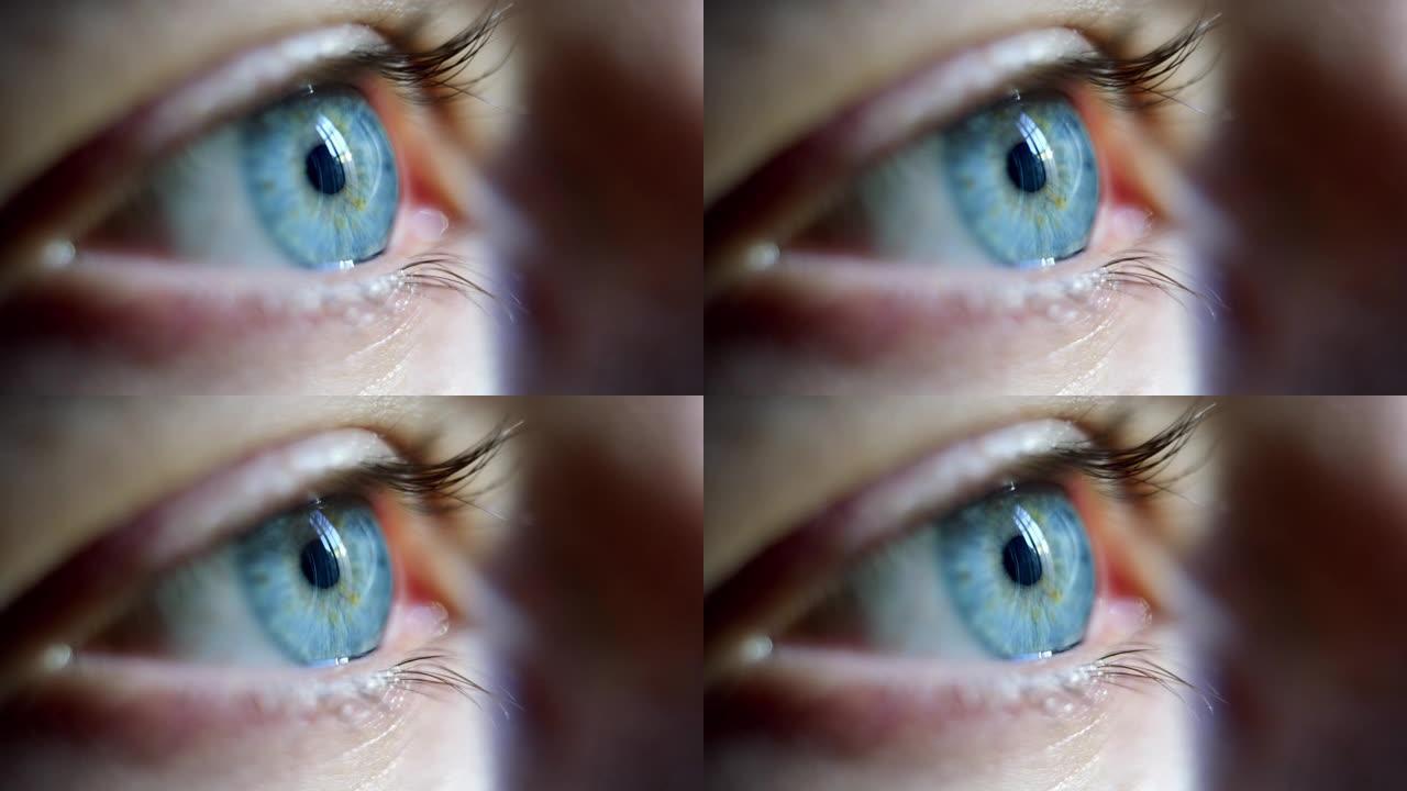 年轻男性蓝眼慢动作眨眼的特写微距镜头。