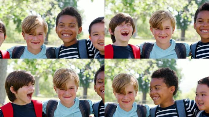 在公园与朋友一起拍摄的一群小男孩的肖像以慢动作拍摄