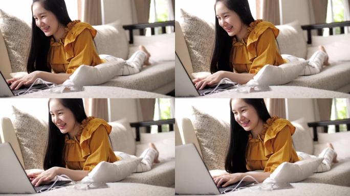 少女在家放松，用笔记本电脑在线购物