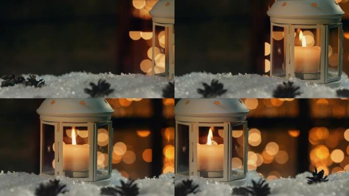 冬季装饰用烛台靠近积雪覆盖的窗户