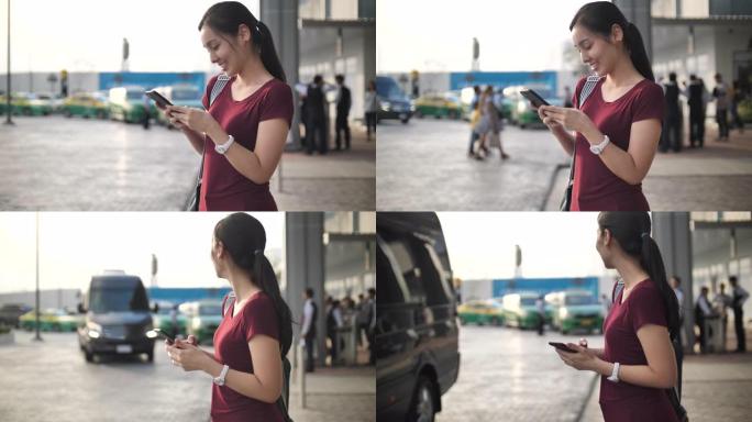 年轻女子从智能手机上请求并等待Uber出租车