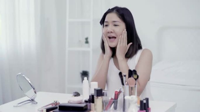 4K分辨率亚洲女性美容博主，v-logger在脸部涂抹粉底霜化妆教程