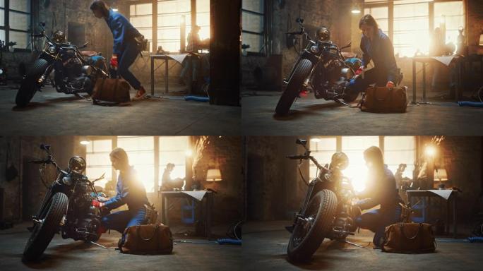 年轻漂亮的女机械师来到车库，开始在定制摩托车上工作。穿着蓝色连体裤的天才女孩。她用棘轮拧紧螺母螺栓。