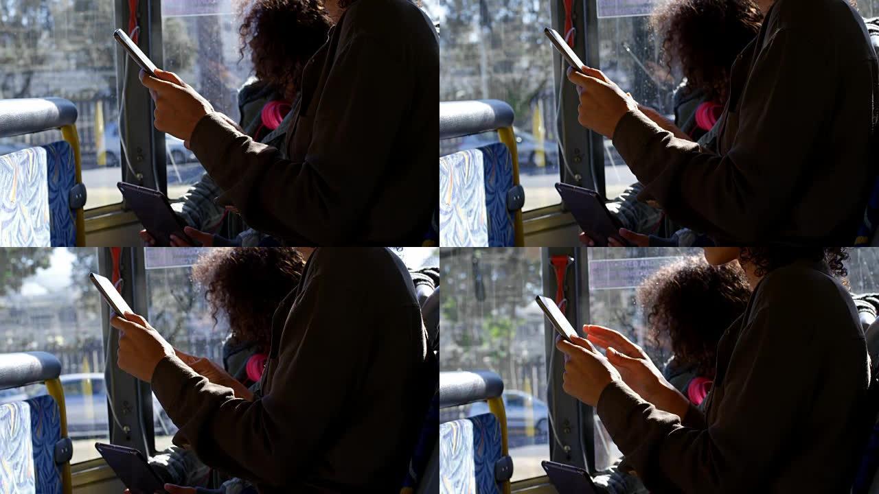 母女俩乘坐4k公交车时使用数字平板电脑