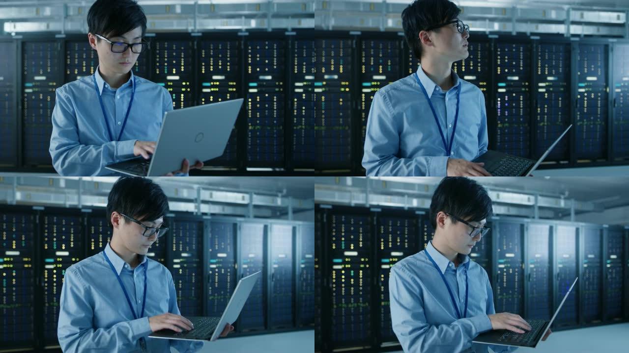 在现代数据中心: IT工程师的肖像站在他身后的服务器机架上，使用笔记本电脑进行维护和诊断程序。弧形摄