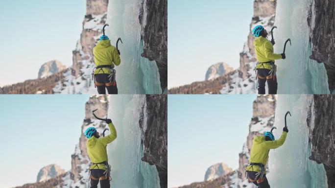 在瀑布上爬冰攀登雪山徒步巅峰爬山