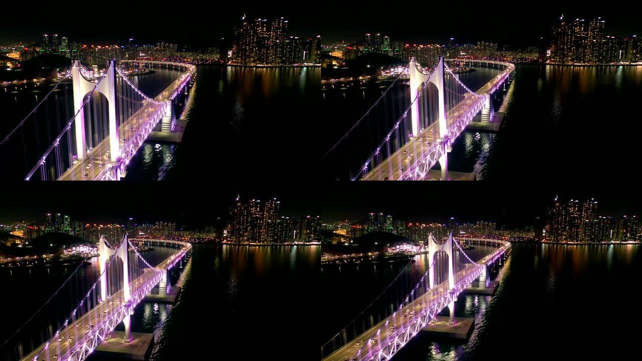 韩国夜间与釜山市的光安桥鸟瞰图