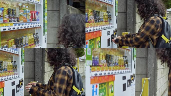 年轻的亚洲年轻女子从自动售货机上购买饮料
