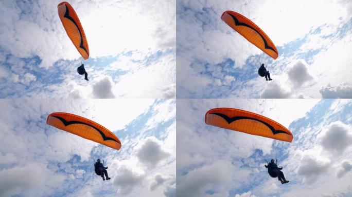 雄性滑翔伞在空中飞得很远。天空中的滑翔伞活动。