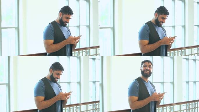 中东男子使用手机发短信