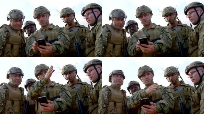 军队士兵在训练期间使用手机4k的正面视图