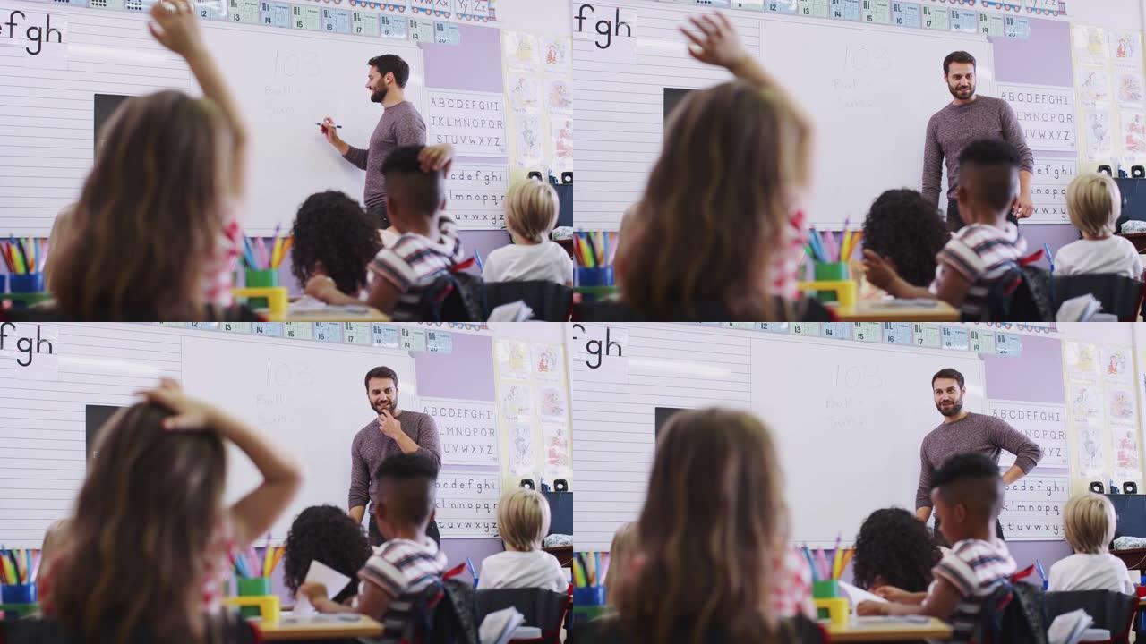 站在白板上的男老师在学校教室里问小学生问题