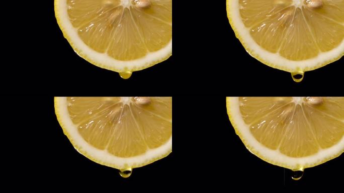 实时: 黑色柠檬片上的液体滴