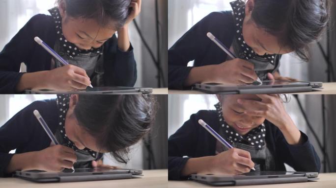 亚洲女孩在家在数字平板电脑上做作业