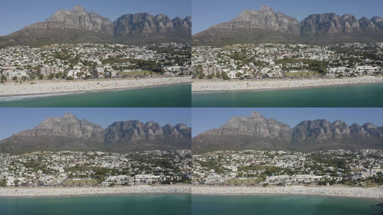 南非开普敦，坎普湾海滩的4k鸟瞰图，背景是12个使徒山