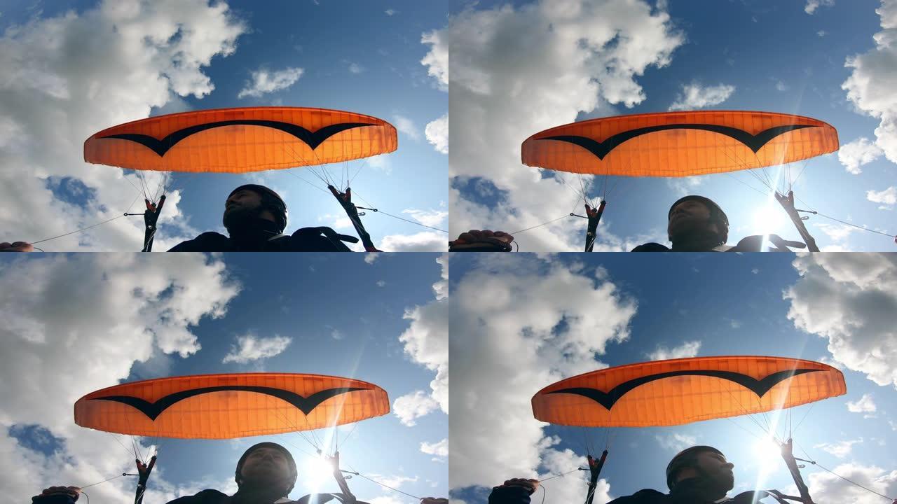 一个有反作用的人的滑翔伞过程。滑翔伞飞行。