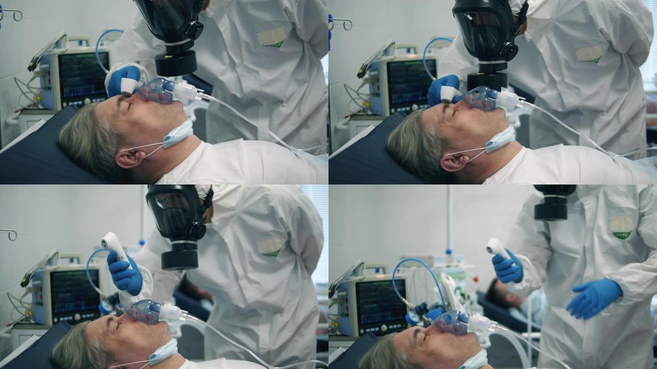 戴着氧气面罩的病人正在检查体温。医生在附近保护冠状病毒病人。
