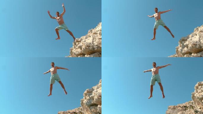 慢动作: 在克罗地亚快乐的男性游客悬崖跳水的电影拍摄。