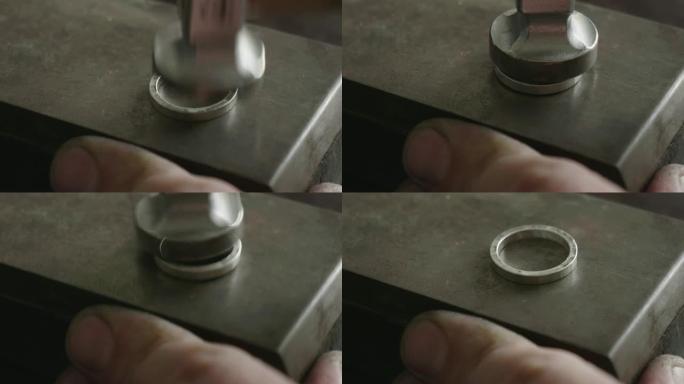 一个金匠用钢做戒指的特写镜头。
