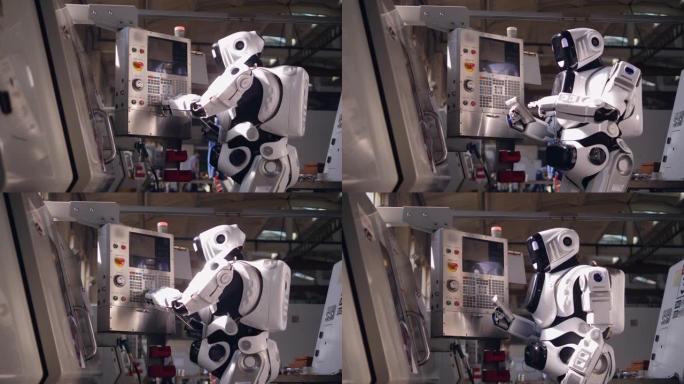 高大的机器人正在操作平板电脑和工业控制台