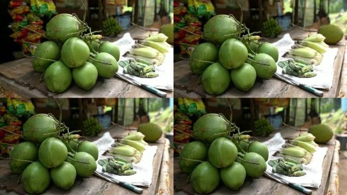 斯里兰卡市场摊位上展示的新鲜椰子，水果和蔬菜女士