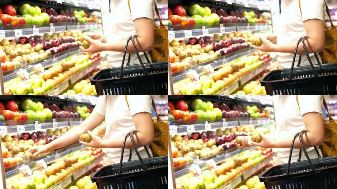 女人选择水果并在超市购物