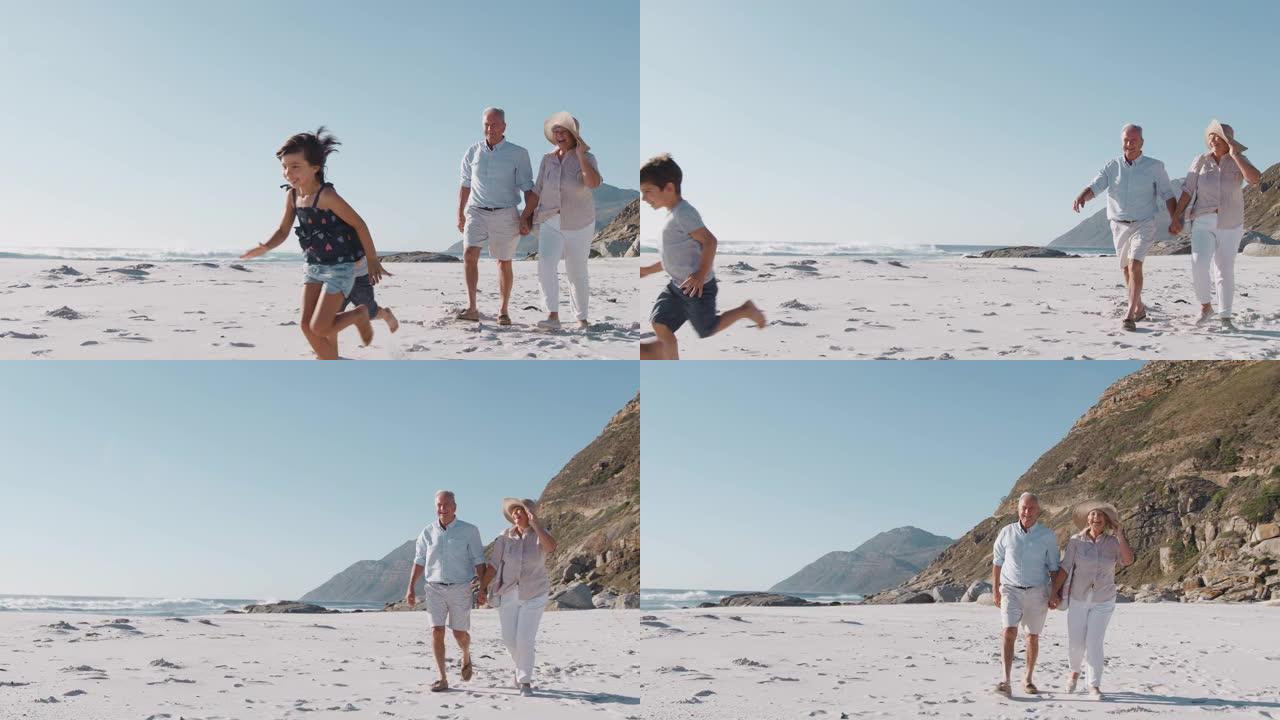 祖父母带着孙子在暑假沿着沙滩散步