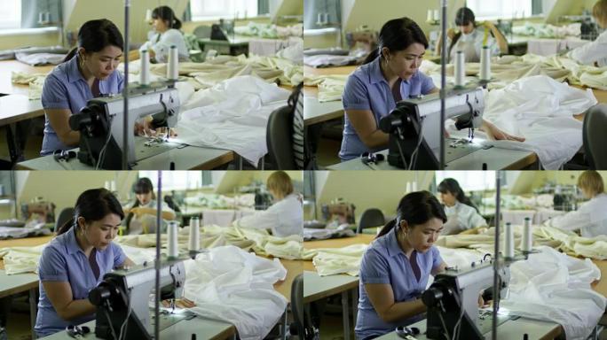 用缝纫机工作的亚洲女性