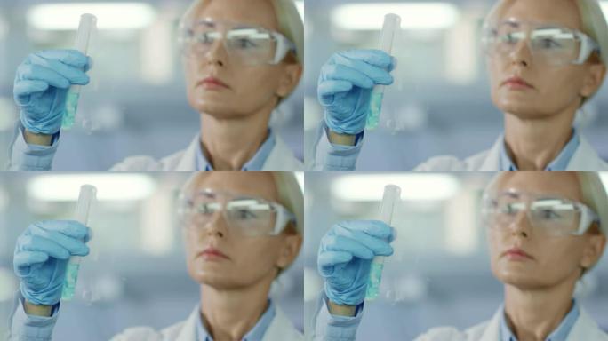 女科学家在试管中观察化学物质的蒸发
