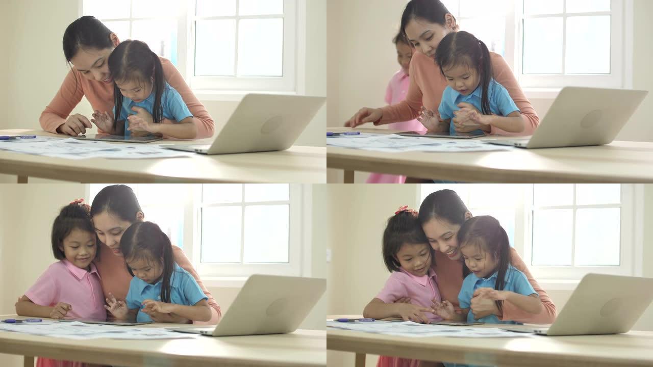 亚洲母亲与女儿一起工作，多任务妈妈