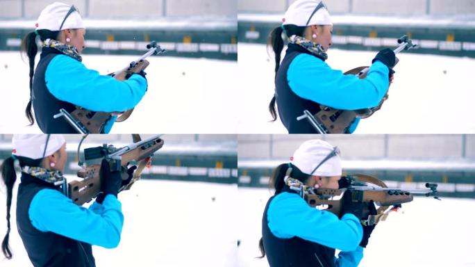 冬季两项步枪被准备射击的女运动员重新装填