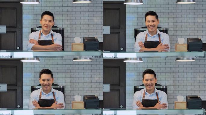 咖啡店亚洲男性员工对着镜头微笑的肖像。成长中的小企业，成长中的小企业，企业家精神，领导力