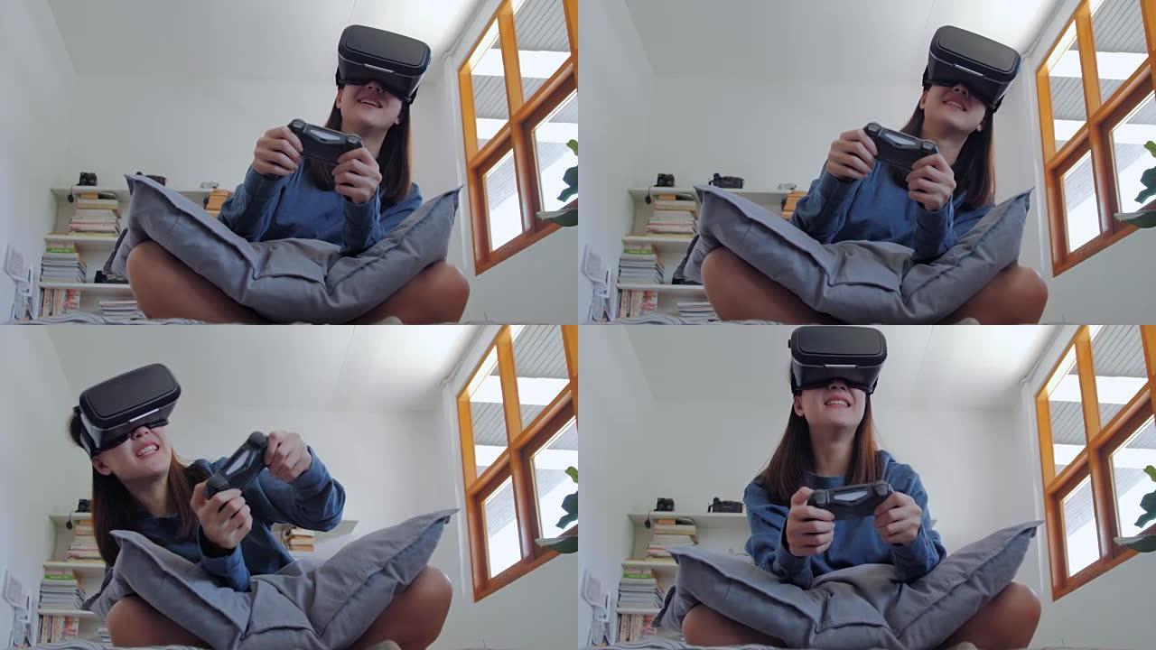 年轻女子快乐玩电子游戏虚拟现实眼镜。快乐的人玩新趋势技术-游戏概念。虚拟现实