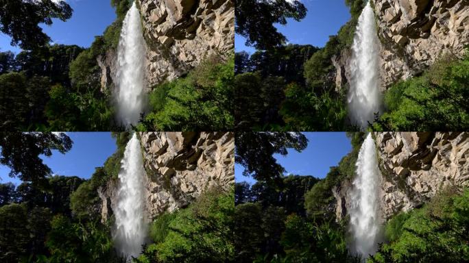 阿根廷安第斯山脉南部巴塔哥尼亚的拉宁国家公园的瀑布中飞溅的水流。瀑布从岩石开始，周围环绕着丰富的绿色