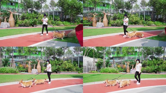 亚洲女子在公园遛狗