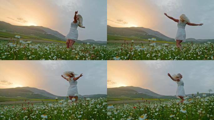 WS超级慢动作快乐的年轻女子在田园诗般的草地上旋转，野花，翁布里亚，意大利