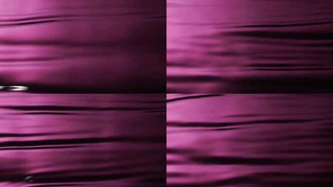 慢动作: 水波图案的粉红色背景。