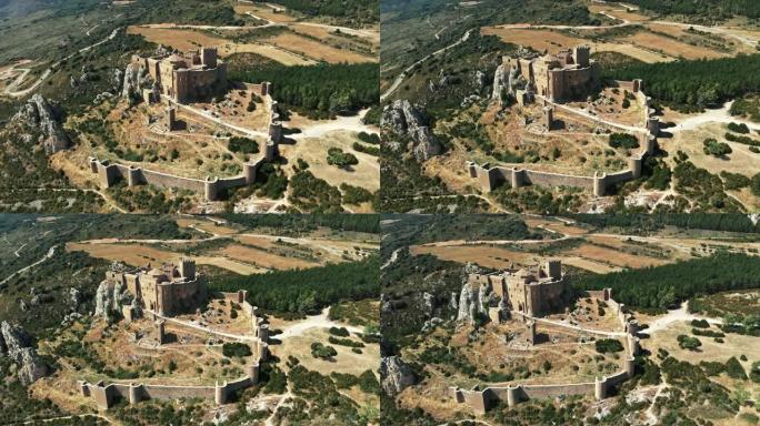在晴朗的晴天，在西班牙阿拉贡的Loarre城堡周围飞行。这是