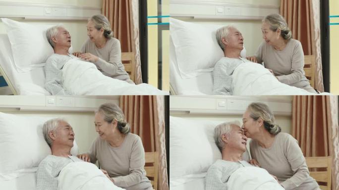 亚洲老妇在床边与丈夫交谈