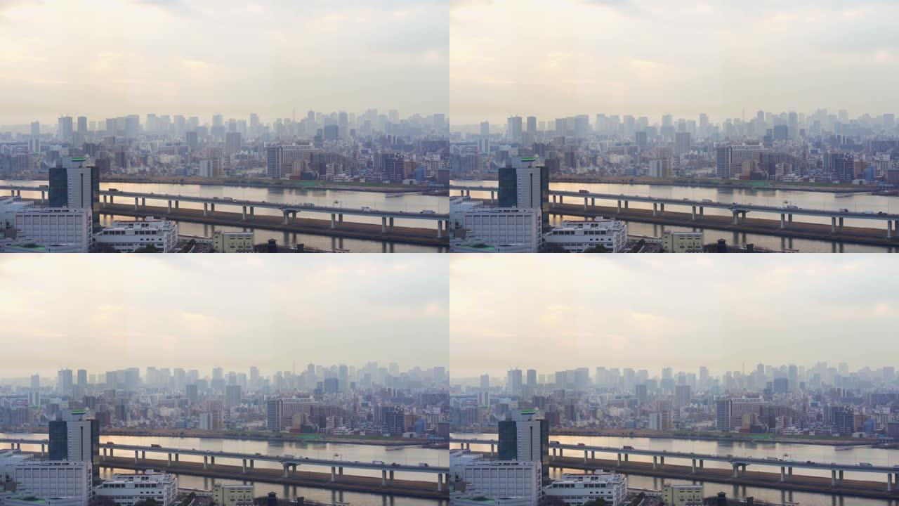 东京铁塔的4k镜头场景与各种建筑的城市景观和交通道路交叉口在日本东京日落时间高峰时间，旅行和交通概念
