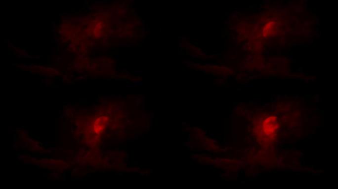 可怕的红色月亮从云层后面出来