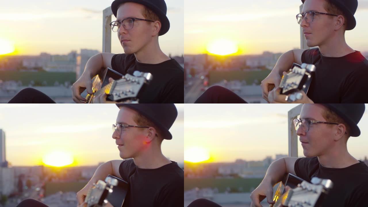 年轻的音乐家在城市屋顶上弹吉他