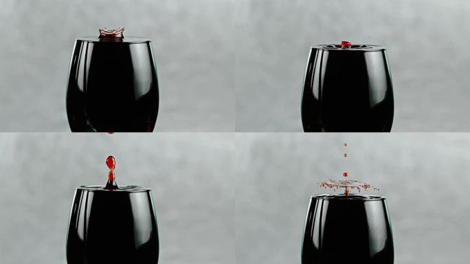 SLO MO滴红酒溅入玻璃杯