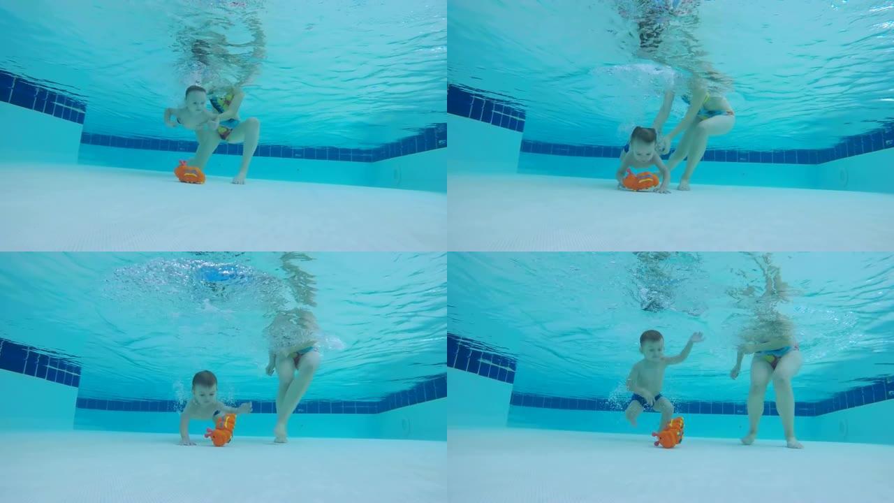 小男孩试图在游泳池里拿玩具，特写镜头。