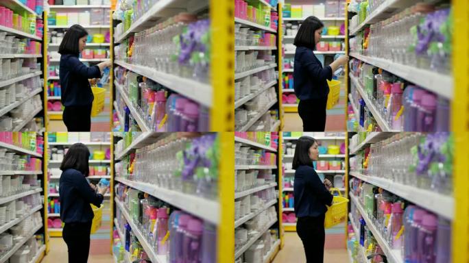 女人在超市选择塑料制品，慢动作